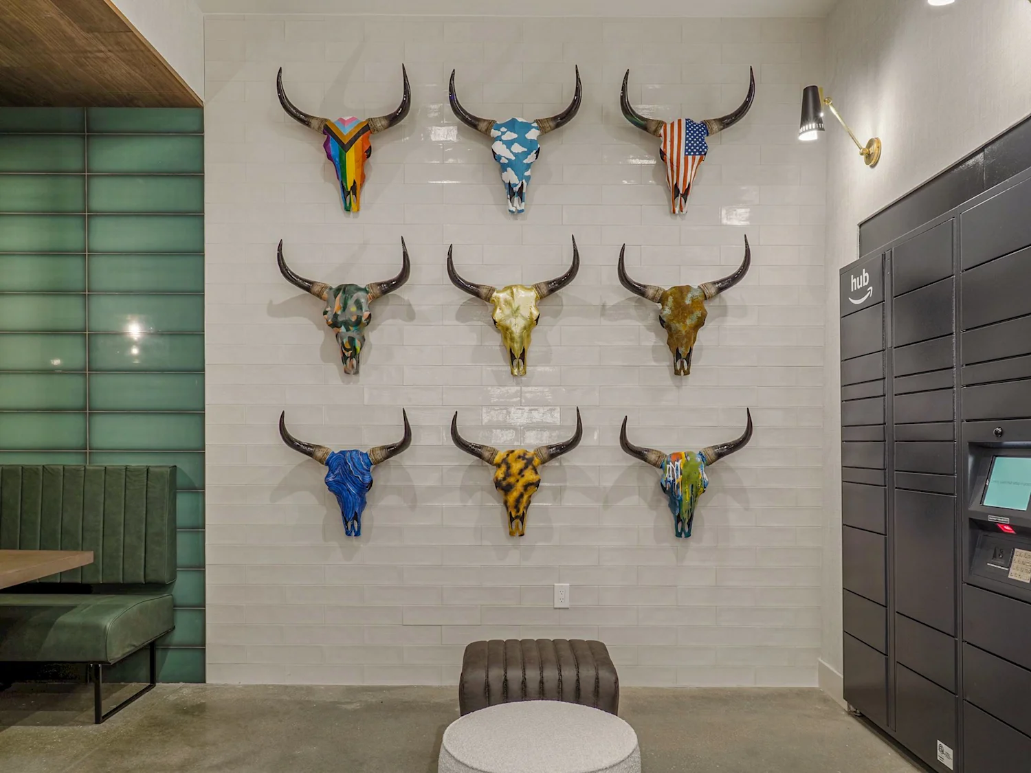 Decorative long horn skulls on wall in co-working space with parcel lockers on the side